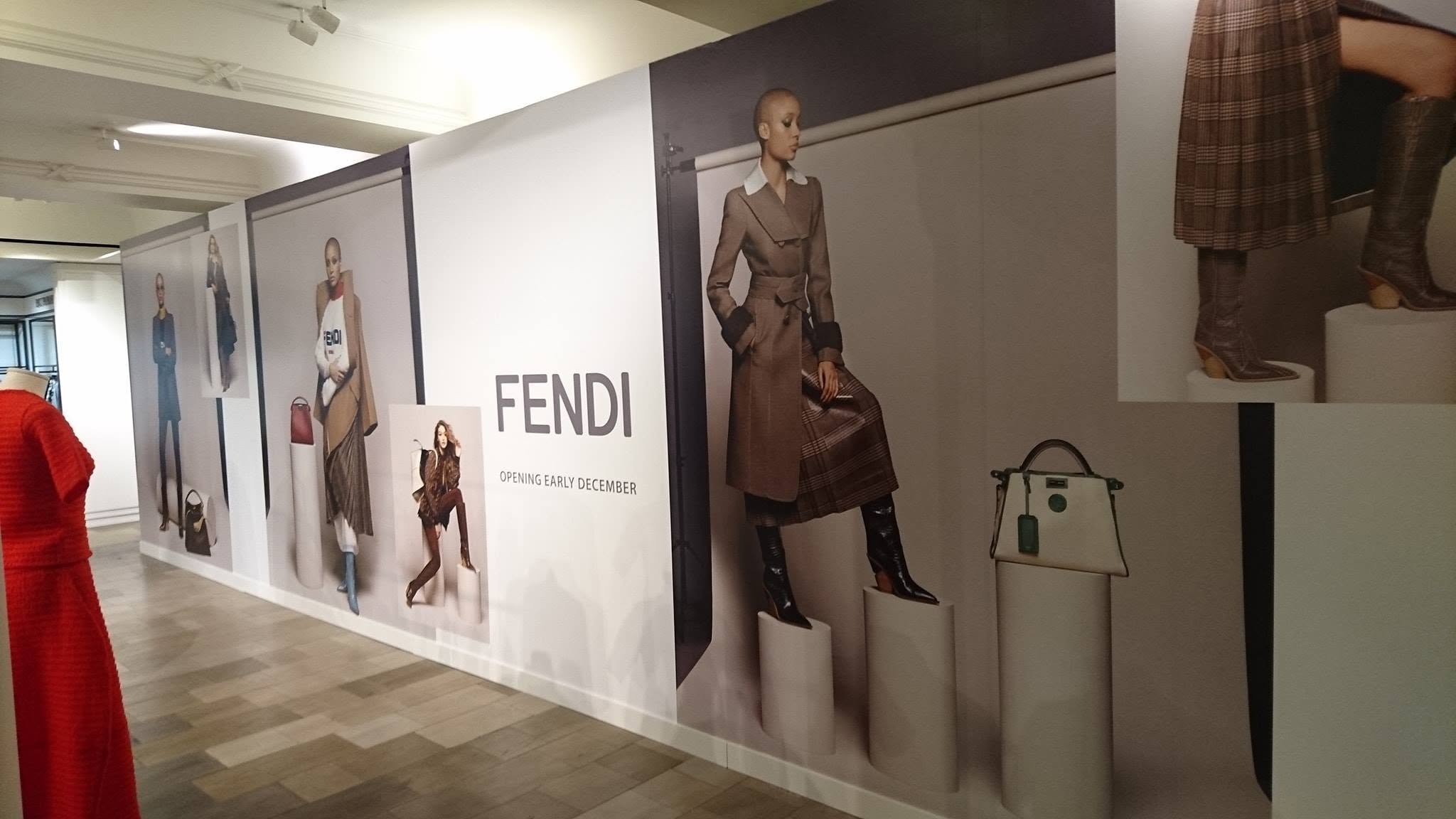Large-format Fendi wall graphics installed inside a luxury department store