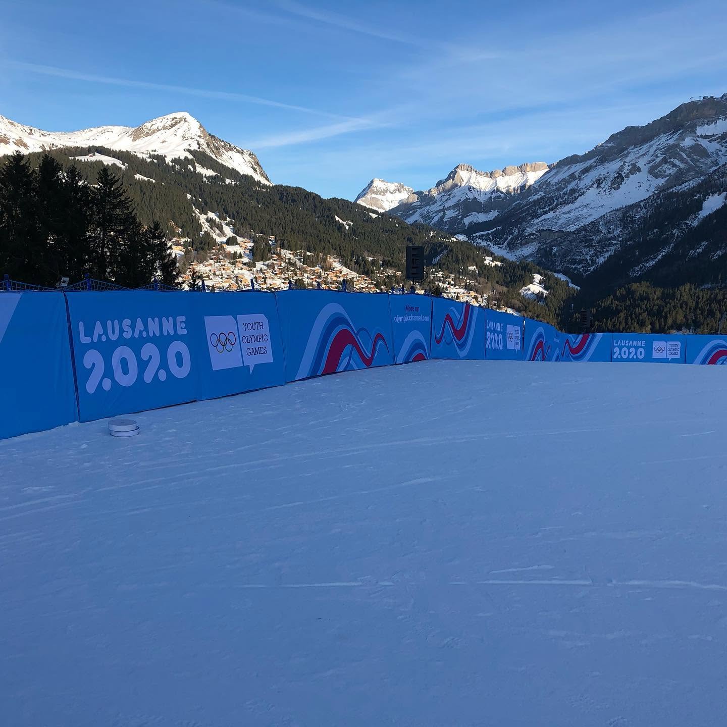 Lausanne 2020 branded vinyl graphics installed along a mountain course